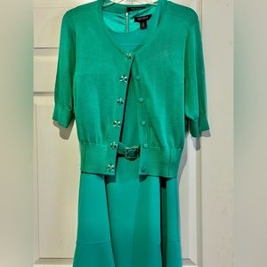 Teal dress with matching cardigan.